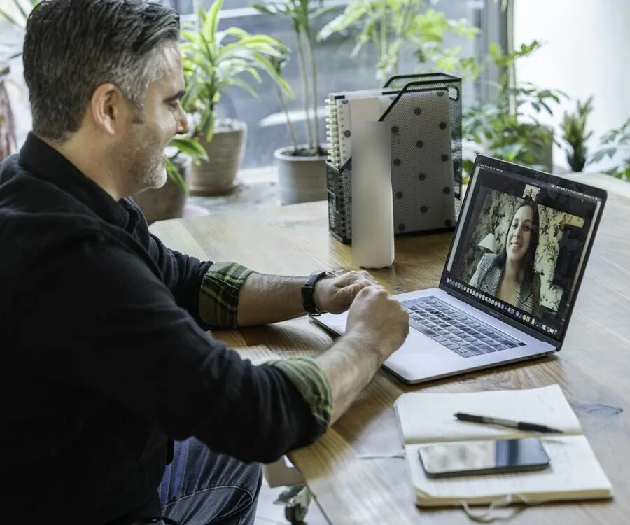Man at home on a video visit on his laptop